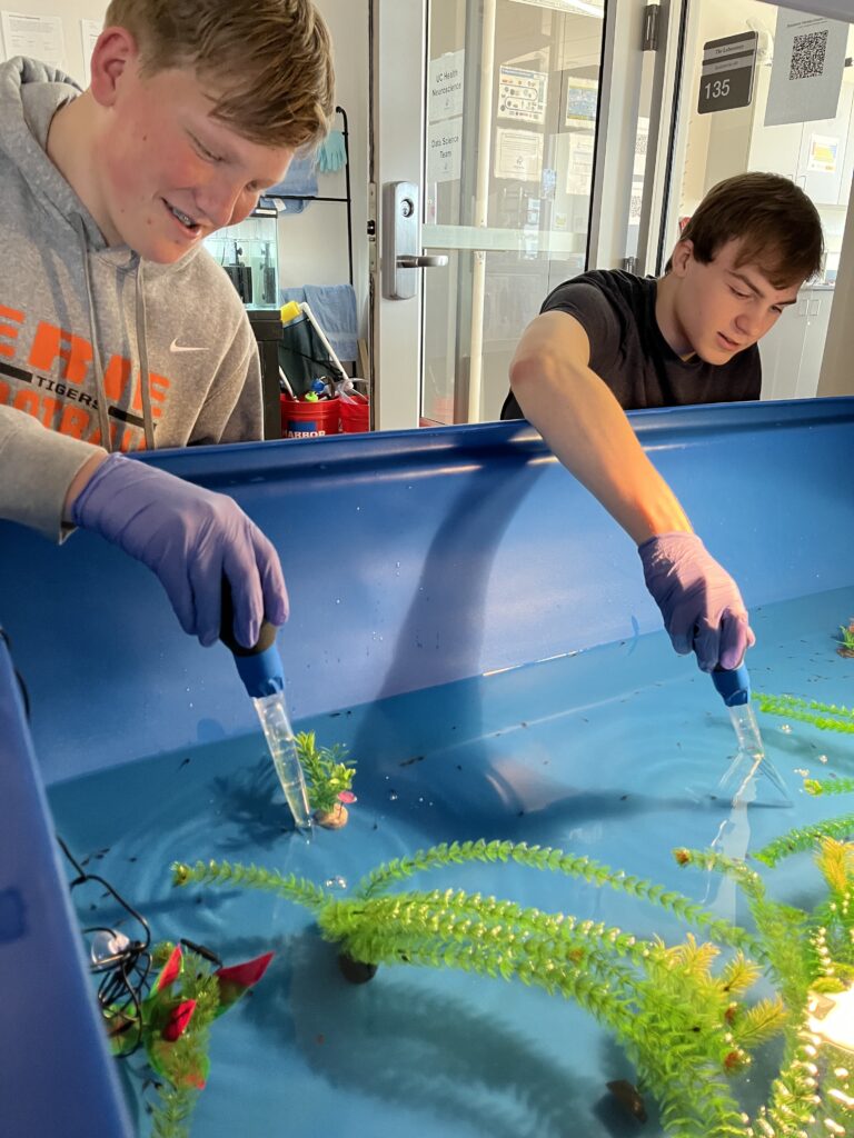 Student working with water tank.