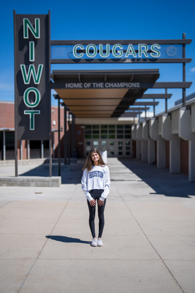 Sia Patel poses in front of Niwot High School.