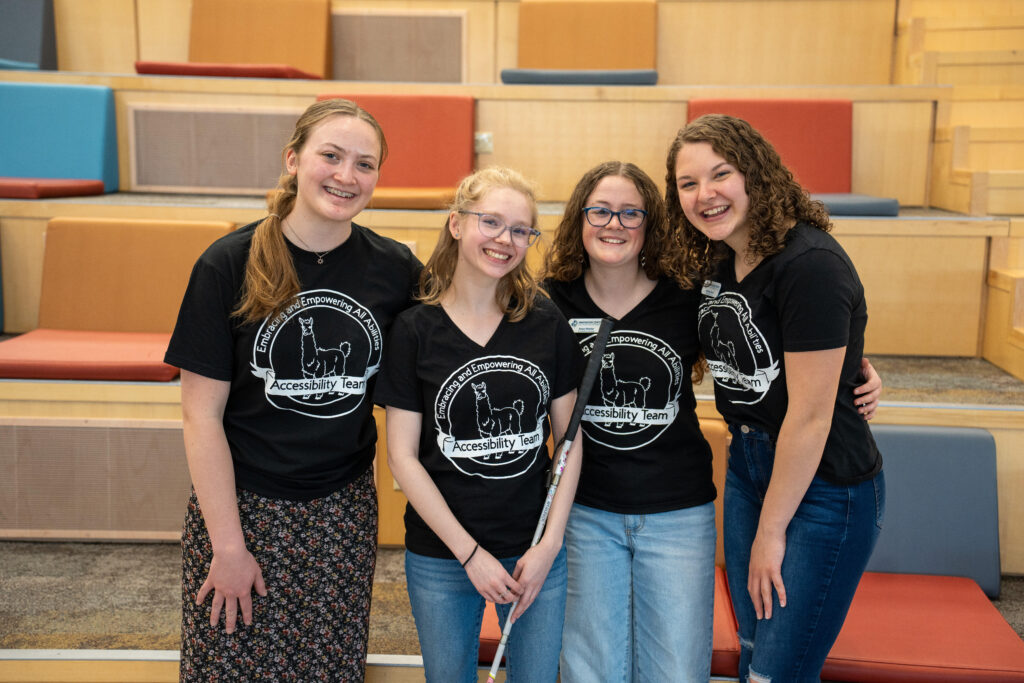 Four, smiling female students on the Accessibility Project Team